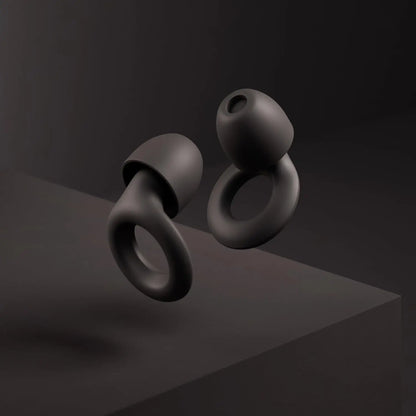 Black wireless earbuds on a dark background