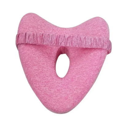 Pink memory foam leg pillow on a white background