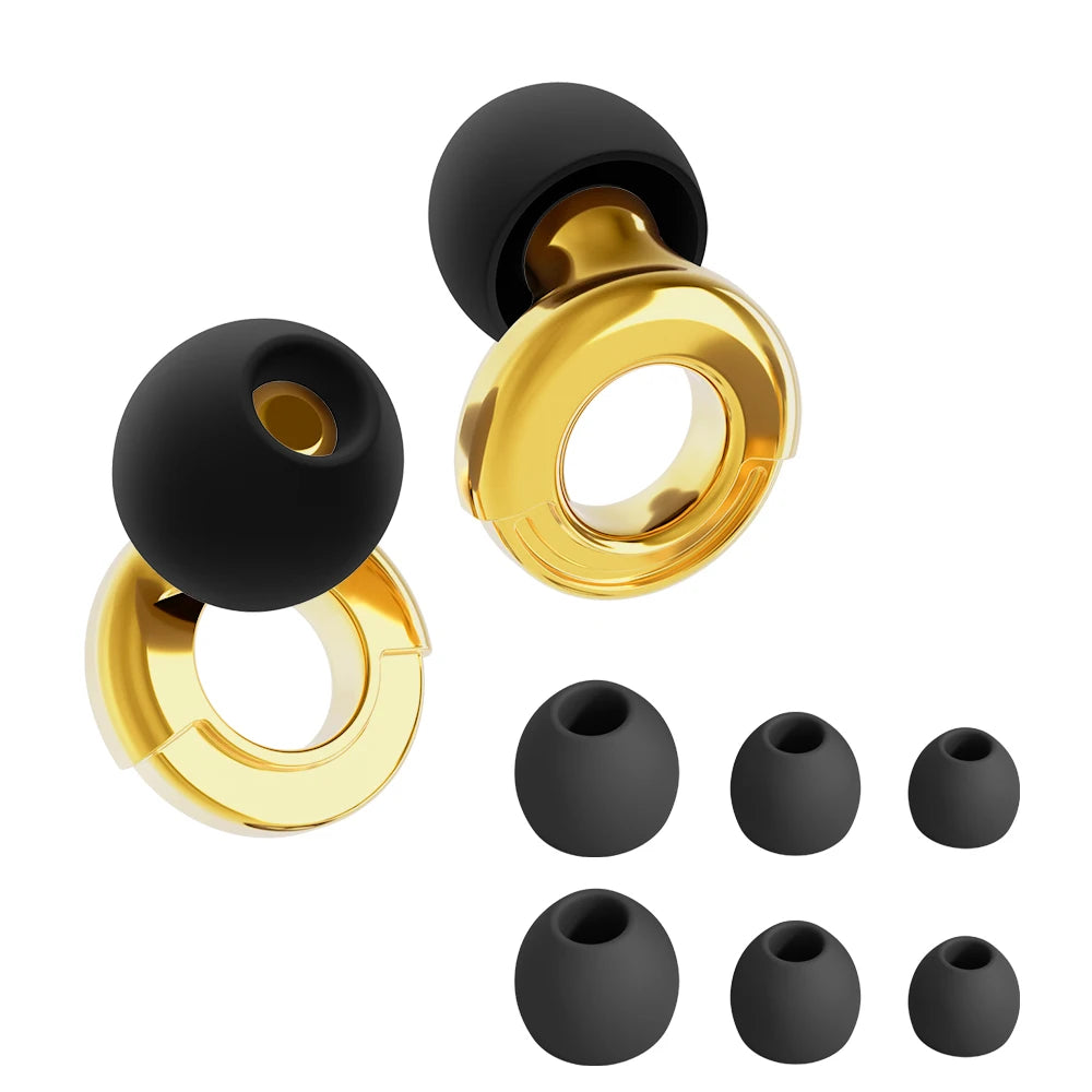 Black silicone earbud tips and gold metal earbud tips on a white background