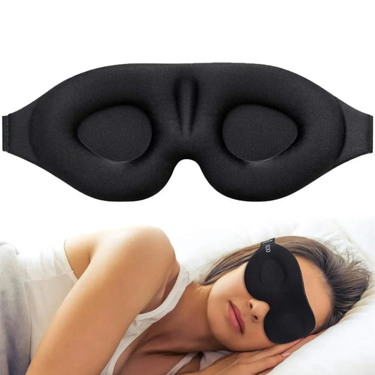 Black sleep mask with a person wearing it in bed on a white background