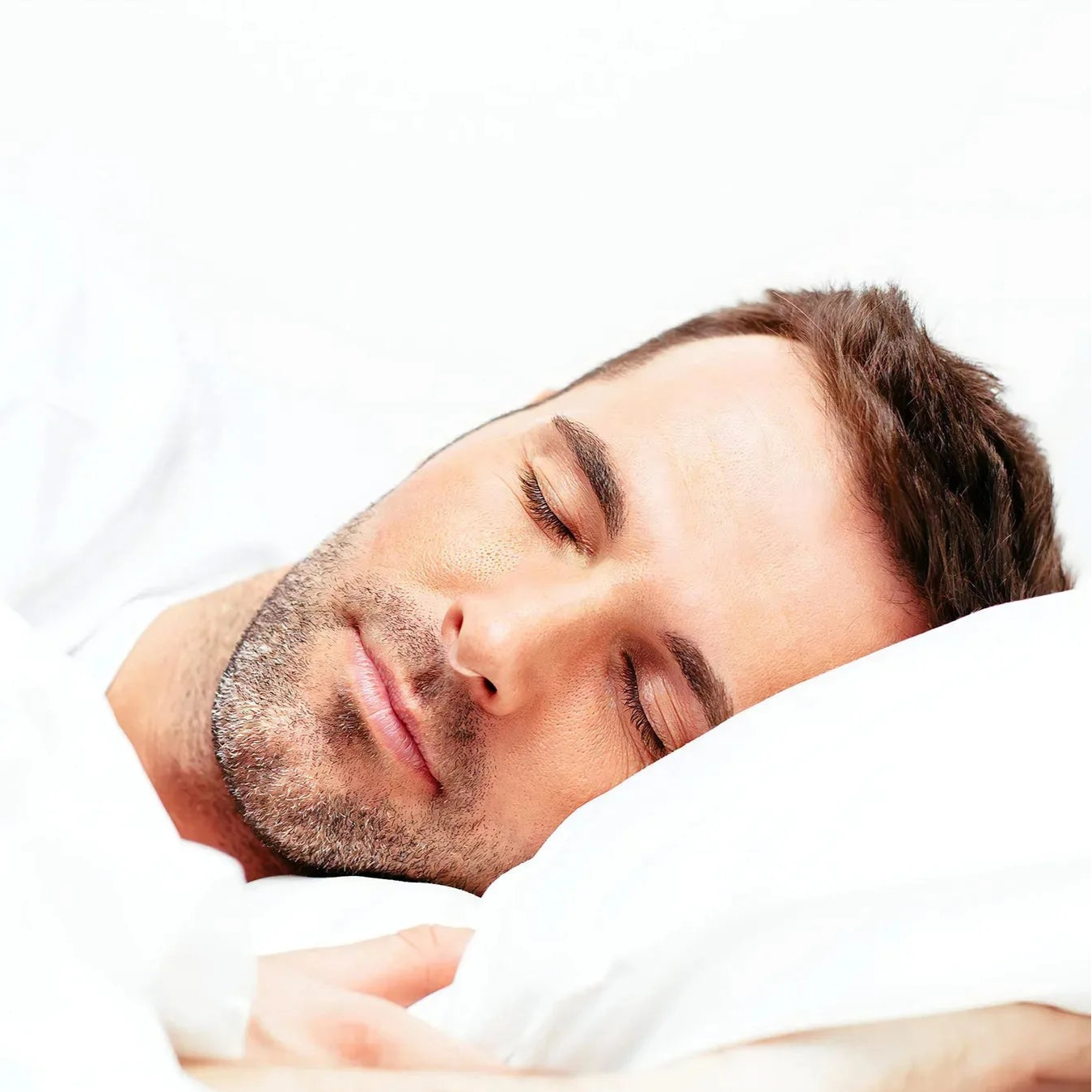 Man sleeping peacefully on a white background